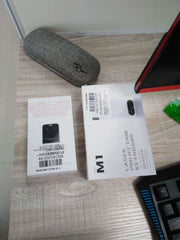Virtual Laser Keyboard Bluetooth Wireless Projector packaging on a desk beside glasses case and keyboard.