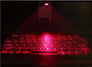 Virtual Laser Keyboard Bluetooth Wireless Projector projecting a red holographic keyboard onto a surface.